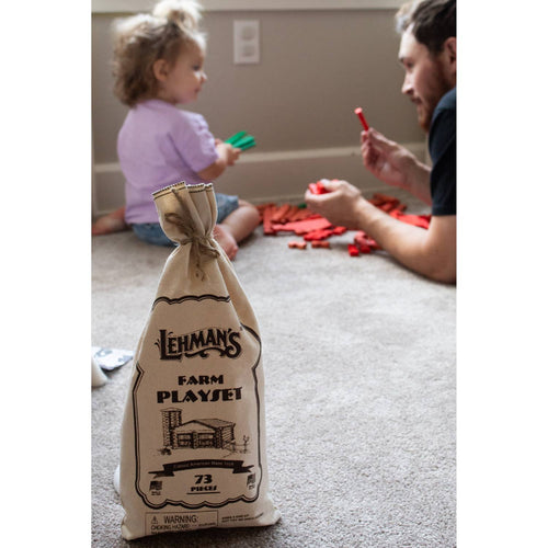 Reusable fabric bag containing a handcrafted wooden log playset with 73 pieces, made in the USA for imaginative indoor play, part of Toys, Books & Games and Wooden Toys collections.