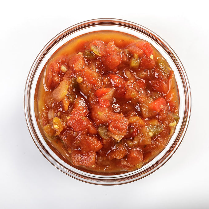 Top-down view of thick, chunky Amish Wedding Salsa in a clear glass bowl, showcasing fresh tomato, pepper, and onion pieces for Kitchen & Food, Snacks and Sweets, Pantry, USA Made, and Best Sellers collections.