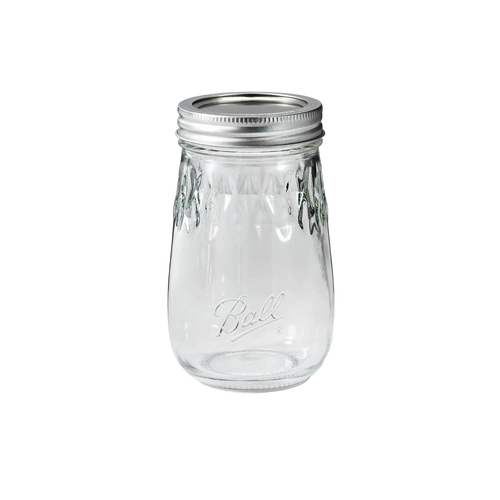 Clear regular-mouth pint canning jar with metal lid and embossed diamond pattern, crafted in the USA for kitchen food preservation and storage use.