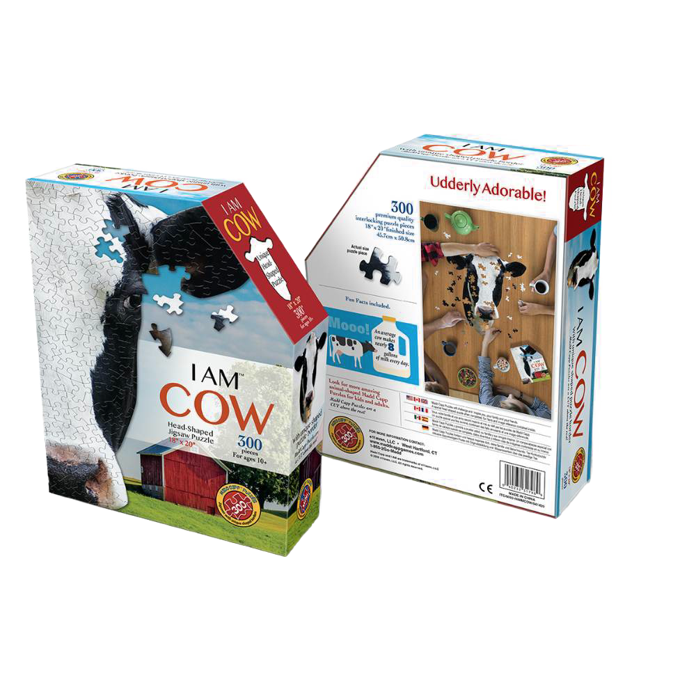 Puzzle box featuring a uniquely cow head-shaped 300-piece jigsaw puzzle with a close-up cow image and barn background, part of Toys, Books & Games and Children's Toys collections.