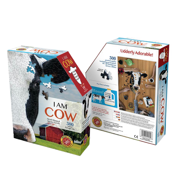 Puzzle box featuring a uniquely cow head-shaped 300-piece jigsaw puzzle with a close-up cow image and barn background, part of Toys, Books & Games and Children's Toys collections.