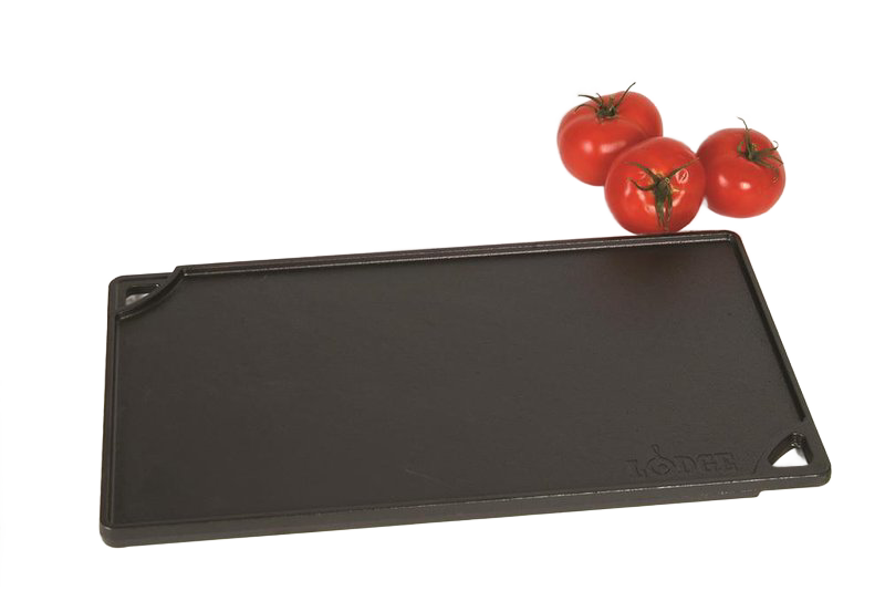 Rectangular cast iron griddle with a smooth cooking surface, corner pour spouts, and embossed logo, accompanied by fresh tomatoes, ideal for Kitchen & Food and USA Made cookware collections.