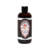 Amber plastic bottle of handcrafted pine tar body wash with black flip-top cap, labeled for health and wellness, grooming, and USA made soap collections.