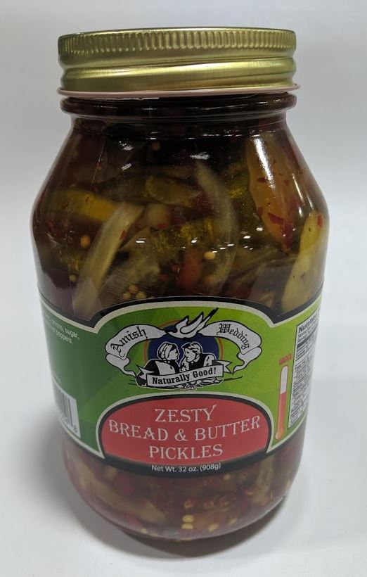 Glass jar of zesty bread and butter pickles with a vintage-style label, featuring a green background and gold lid, handcrafted and made in USA, ideal for Kitchen & Food, Pantry, USA Made, Best Sellers, Promo Eligible collections.