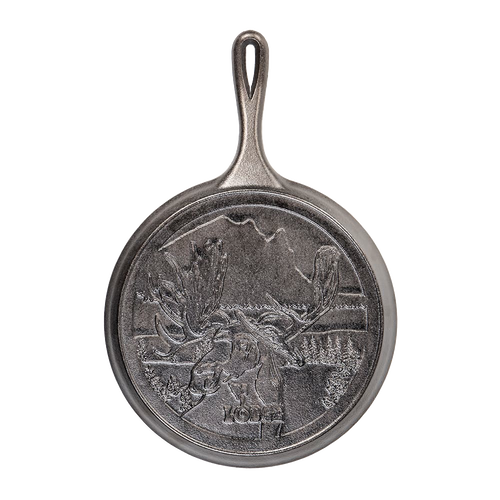 Cast iron griddle with detailed moose design and scenic Northwoods background, handcrafted in the USA, ideal for Kitchen & Food, Cookware, Cast Iron, and Best Sellers collections.