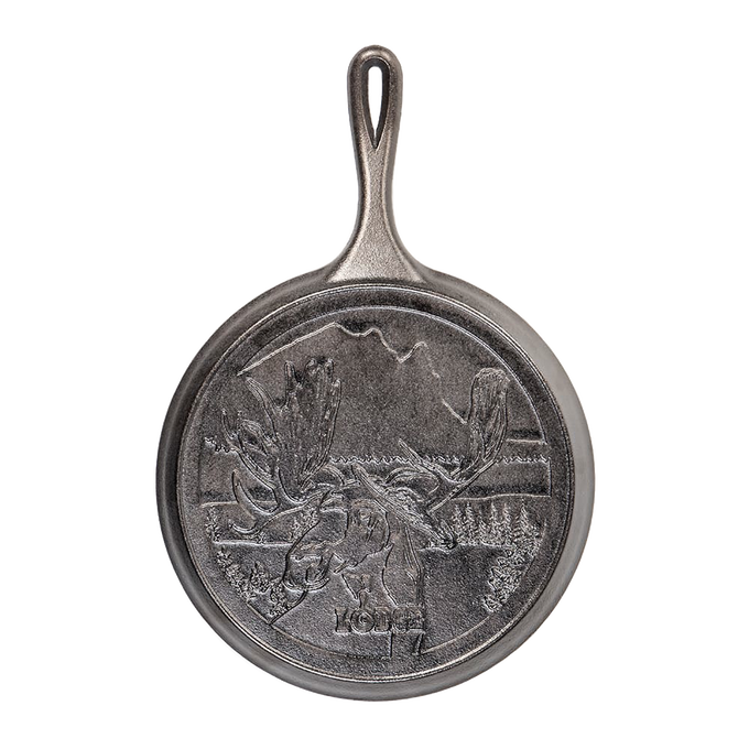 Cast iron griddle with detailed moose design and scenic Northwoods background, handcrafted in the USA, ideal for Kitchen & Food, Cookware, Cast Iron, and Best Sellers collections.