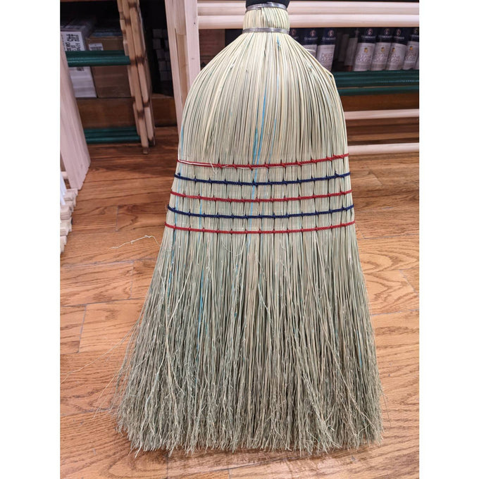 Handcrafted large corn broom with natural straw bristles bound by colorful stitching, Amish made in the USA, perfect for farm, garden, and household cleaning tasks.