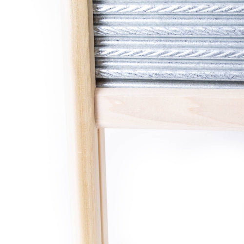 Handcrafted galvanized washboard with unique spiral crimp surface and sturdy mortised wooden frame, exclusive to USA-made Home & Decor and Laundry Supplies collections.