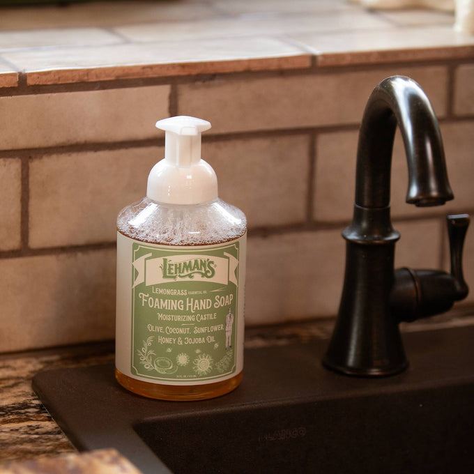 Clear pump bottle of handcrafted lemongrass foaming hand soap featuring natural ingredients including olive, coconut, sunflower oils, honey, and jojoba, made in USA, ideal for Health & Wellness and Grooming collections.