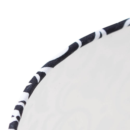 Close-up of the edge of an Aladdin oil lamp shade featuring black and white damask cloth trim, crafted for durability and style in Lamps & Lighting and Lamp Shades collections.