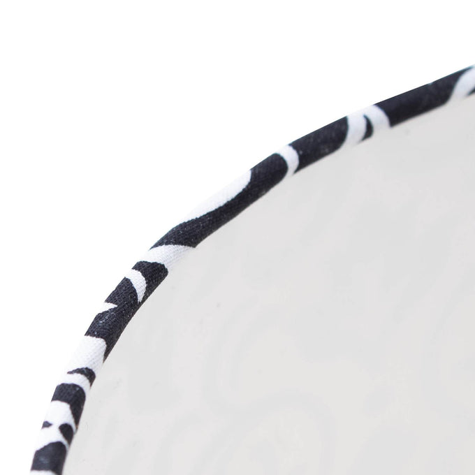 Close-up of the edge of an Aladdin oil lamp shade featuring black and white damask cloth trim, crafted for durability and style in Lamps & Lighting and Lamp Shades collections.