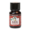 Dark amber glass bottle with black cap containing handcrafted beard oil, featuring an illustrated badger logo and red label, made in USA for grooming and personal care.