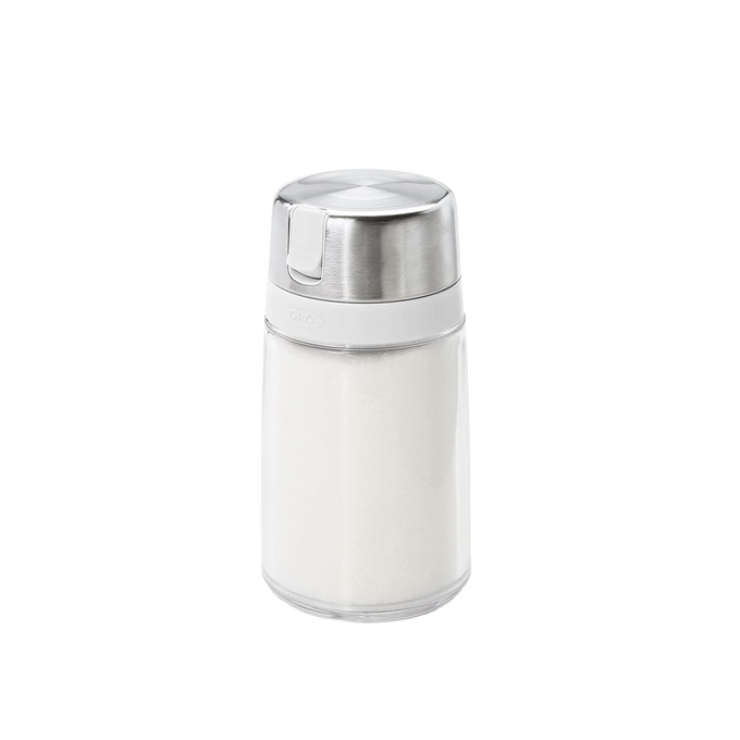 Clear glass sugar dispenser with stainless steel lid and side spout designed to minimize moisture and prevent clumping, ideal for Kitchen & Food, Kitchen Gadgets, Storage and Serving collections.
