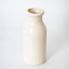 Simple off-white handcrafted stoneware milk bottle made in the USA, perfect for farmhouse-style decor, kitchen use, or as a unique vase in Home & Decor and Kitchen & Food collections.