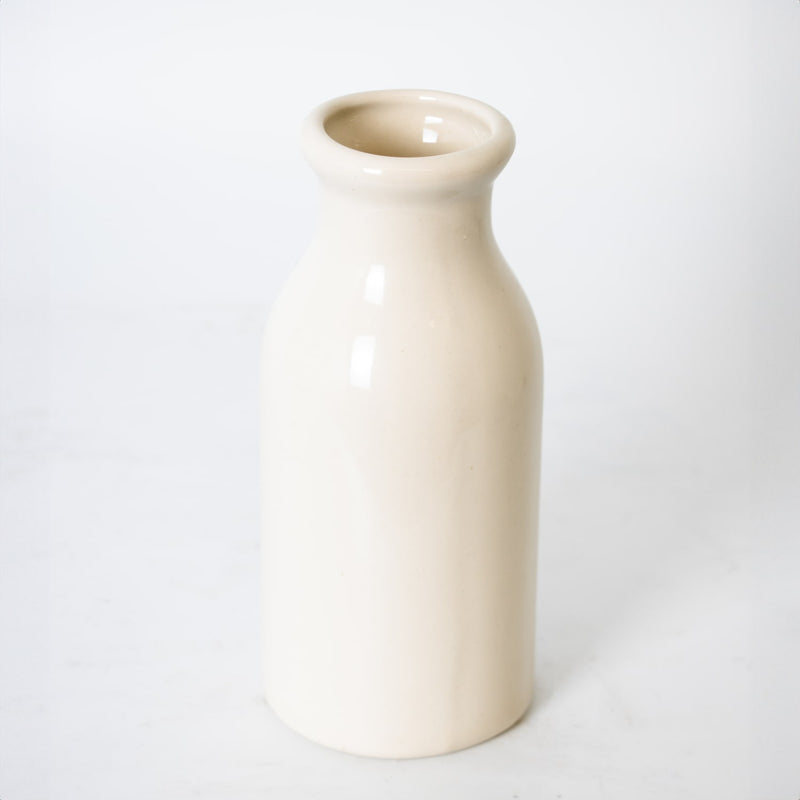 Simple off-white handcrafted stoneware milk bottle made in the USA, perfect for farmhouse-style decor, kitchen use, or as a unique vase in Home & Decor and Kitchen & Food collections.