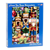 Blue box featuring a colorful holiday-themed puzzle of three detailed nutcrackers surrounded by ornaments and festive decorations, handcrafted and made in USA, ideal for Toys, Books & Games, Games and Puzzles, Puzzles, Best Sellers, and Promo Eligible collections.