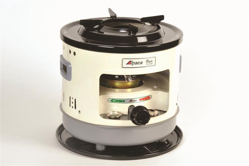 Compact Alpaca kerosene cooker with visible fuel gauge, detachable spill tray, and durable fiberglass wick, designed for outdoor use in camping, emergency supplies, and farm tool collections.
