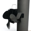Black three-bladed magnetic stove fan mounted on a flue pipe with metal fins for heat-powered air circulation, featured in Stoves, Hearth Accessories, Best Sellers, and Promo Eligible collections.
