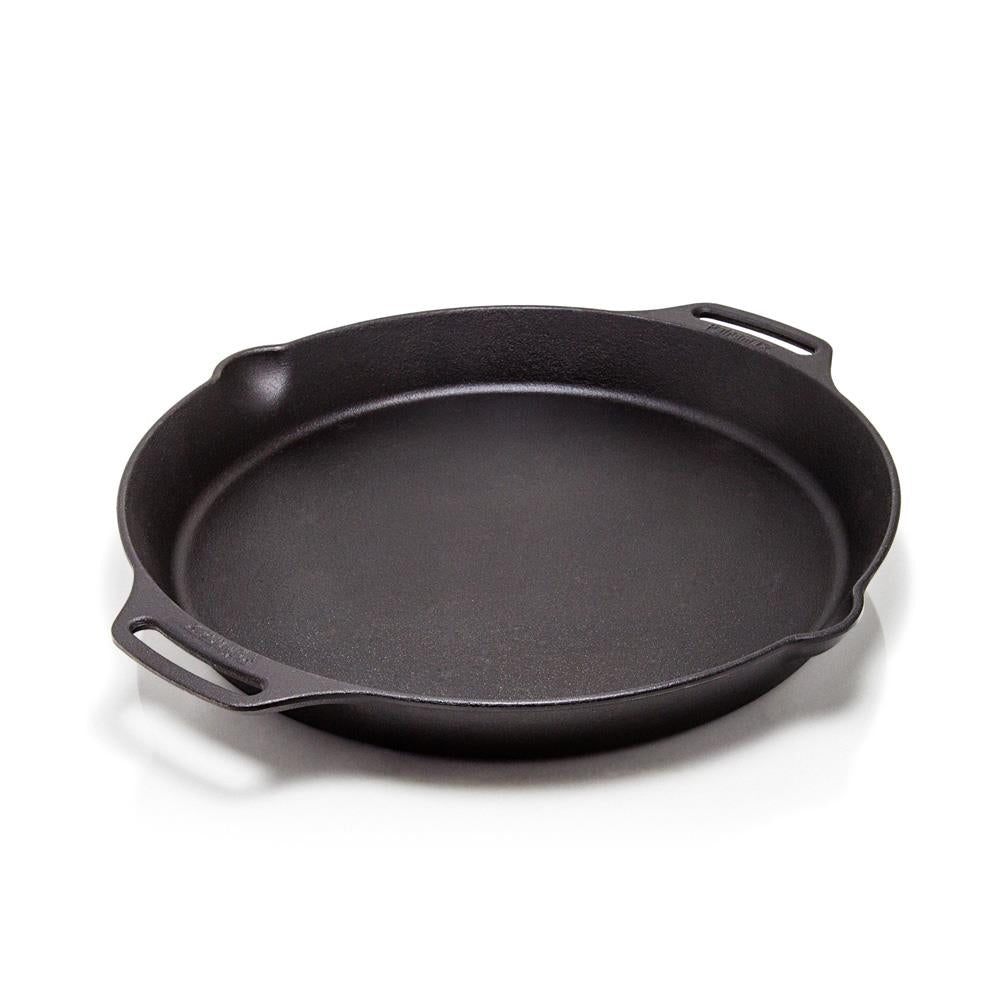 Round cast iron fire skillet with two sturdy handles and a small pouring spout, ideal for farm, garden, camping, kitchen, cookware, and cast iron collections.