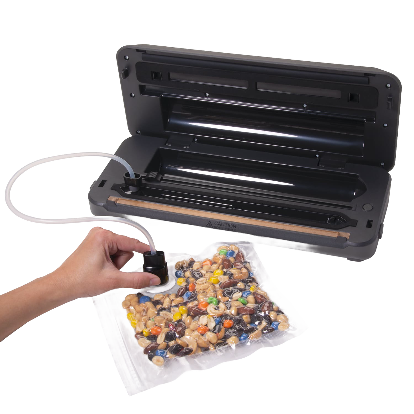 Black automatic vacuum sealer with integrated bag cutter sealing a clear bag of mixed nuts and candy, ideal for Kitchen & Food, Food Preservation, Freezing, and Best Sellers collections.
