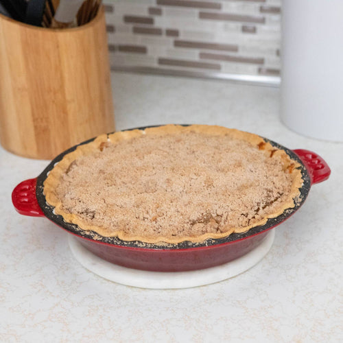 Handcrafted cast iron pie pan with crimped edges and red exterior holding a freshly baked crumb-topped pie on a kitchen countertop, perfect for Kitchen & Food, Cast Iron, Cookware, Baking Supplies, Best Sellers, and Promo Eligible collections.