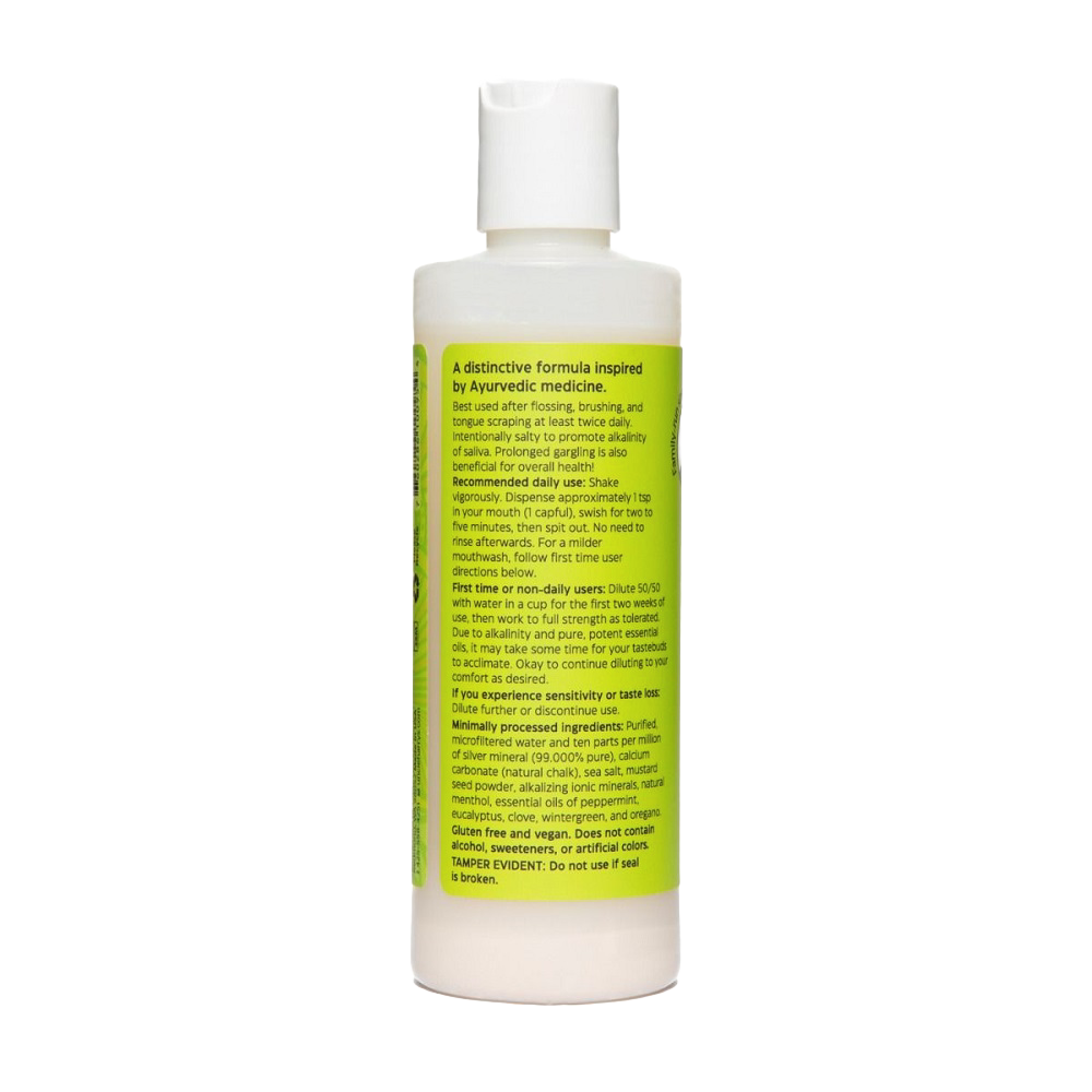 White plastic bottle of natural mouthwash with a flip-top cap and a yellow label featuring usage instructions and ingredient details, ideal for Health & Wellness, Grooming and Personal Hygiene, USA Made, and Best Sellers collections.