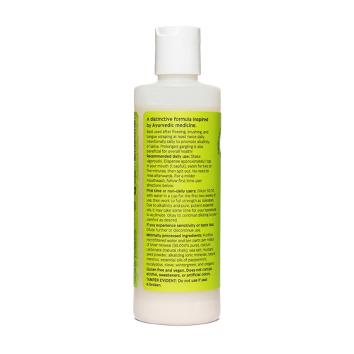 White plastic bottle of natural mouthwash with a flip-top cap and a yellow label featuring usage instructions and ingredient details, ideal for Health & Wellness, Grooming and Personal Hygiene, USA Made, and Best Sellers collections.