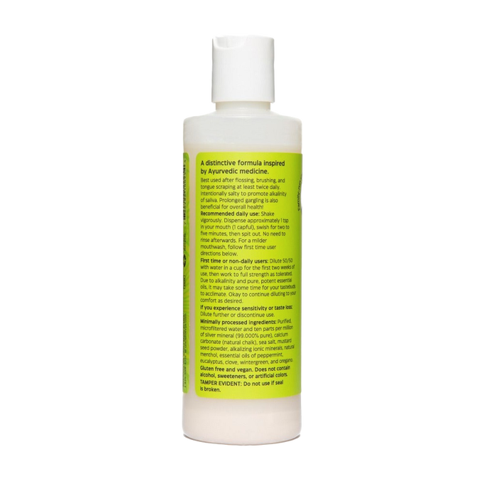 White plastic bottle of natural mouthwash with a flip-top cap and a yellow label featuring usage instructions and ingredient details, ideal for Health & Wellness, Grooming and Personal Hygiene, USA Made, and Best Sellers collections.
