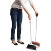 Person holding an OXO Sweep Set with an extendable broom featuring soft flagged bristles and an extra-large dustpan, ideal for Home & Decor, Household Cleaning, and Cleaning Utensils collections.