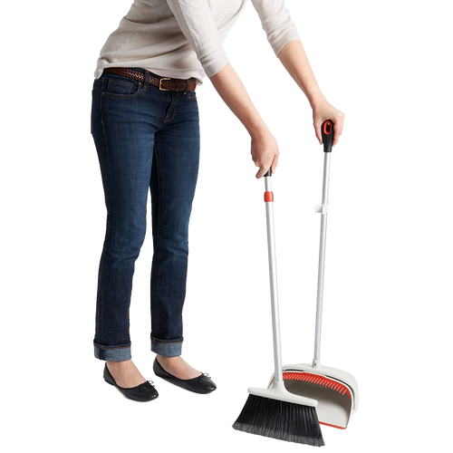 Person holding an OXO Sweep Set with an extendable broom featuring soft flagged bristles and an extra-large dustpan, ideal for Home & Decor, Household Cleaning, and Cleaning Utensils collections.