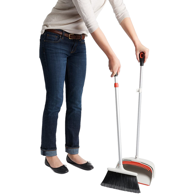 Person holding an OXO Sweep Set with an extendable broom featuring soft flagged bristles and an extra-large dustpan, ideal for Home & Decor, Household Cleaning, and Cleaning Utensils collections.