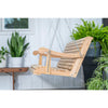 Handcrafted cypress wood porch swing with smooth curved armrests, hanging securely by metal chains, surrounded by green plants, ideal for Home & Decor and Outdoor Furniture collections.