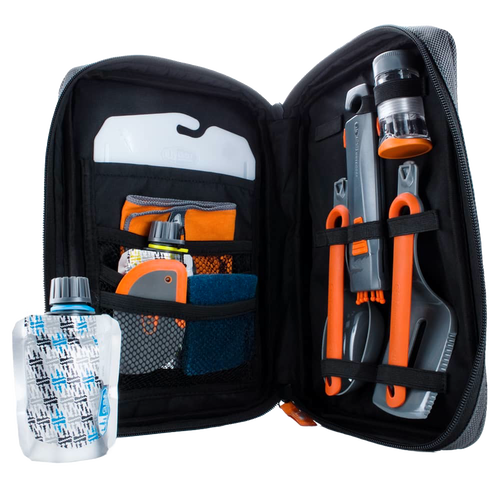Compact black zippered case opened to reveal an organized 11-piece orange and gray camping kitchen set with utensils, collapsible containers, and cleaning tools, ideal for outdoor cooking and camping gear collections.