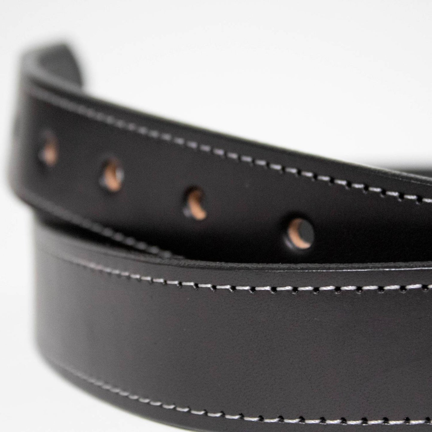 Close-up of a handcrafted black genuine English bridle leather belt with precise stitching and multiple punched holes, Amish made in USA, featured in Clothing and Accessories, USA Made, Amish Made, Best Sellers collections.