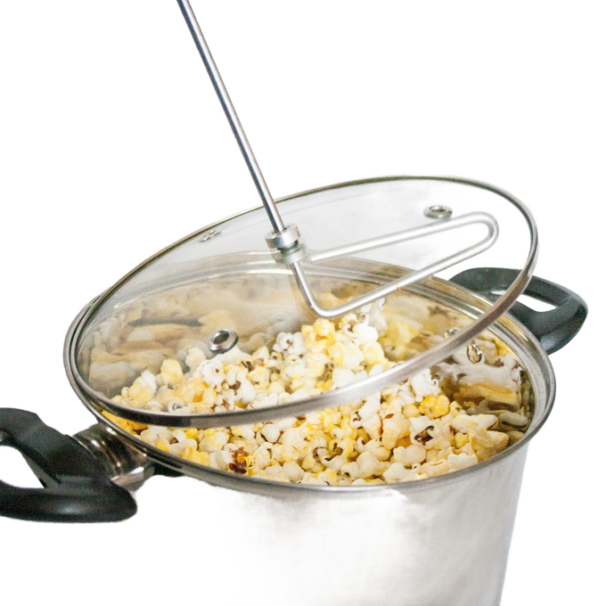 Stainless steel stovetop popcorn popper with glass lid, black handles, and manual stirring arm, handcrafted for Kitchen & Food, Cookware, Pots and Pans, and Best Sellers collections.
