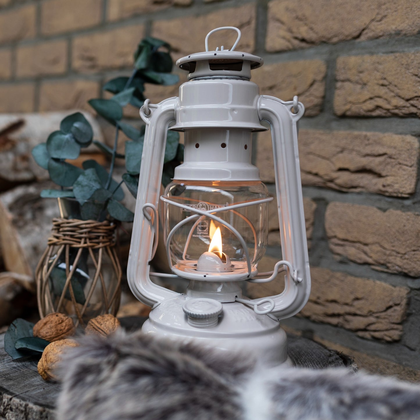 Handcrafted light gray galvanized lantern with thermal heat-resistant globe lit softly on a wooden surface near rustic decor, perfect for Lamps & Lighting, Camping, and Emergency Supplies collections.