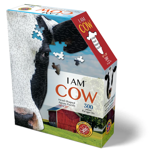 Box for a handcrafted, cow head-shaped 300-piece jigsaw puzzle featuring a close-up cow image and a barn scene, part of toys and games collections for ages 10 and up.