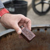 Handcrafted Lehman's fire starter made in the USA, held over a fire ring for easy, non-toxic campfire and wood stove lighting, featured in Farm, Garden & Tool and Camping collections.
