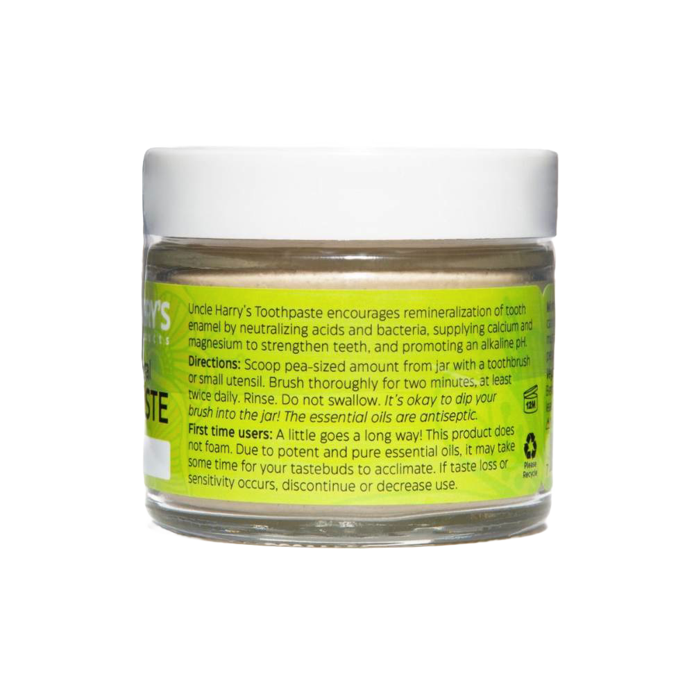 Clear glass jar with white lid containing handcrafted all-natural alkalizing toothpaste in a bright yellow label, promoting Health & Wellness, Grooming and Personal Hygiene, USA Made, Best Sellers, and Promo Eligible collections.