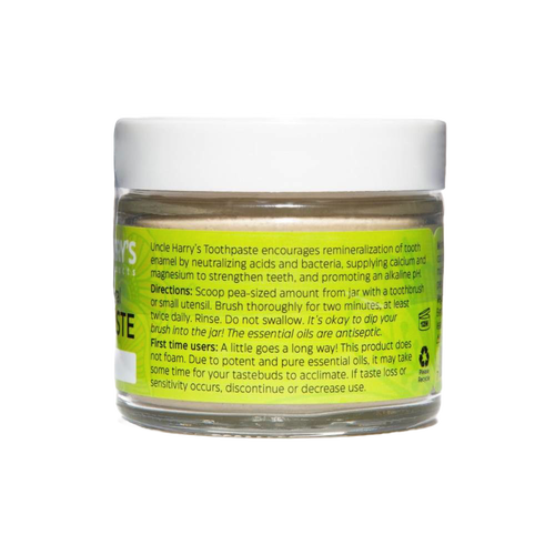 Clear glass jar with white lid containing handcrafted all-natural alkalizing toothpaste in a bright yellow label, promoting Health & Wellness, Grooming and Personal Hygiene, USA Made, Best Sellers, and Promo Eligible collections.