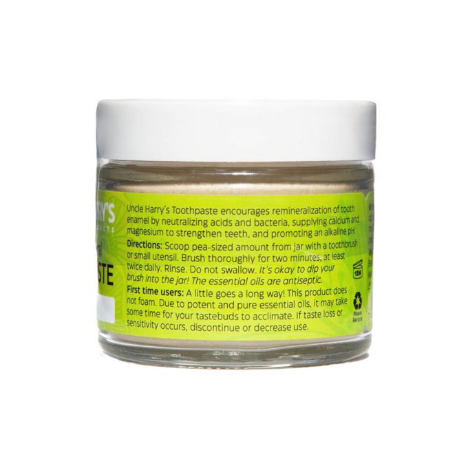Clear glass jar with white lid containing handcrafted all-natural alkalizing toothpaste in a bright yellow label, promoting Health & Wellness, Grooming and Personal Hygiene, USA Made, Best Sellers, and Promo Eligible collections.