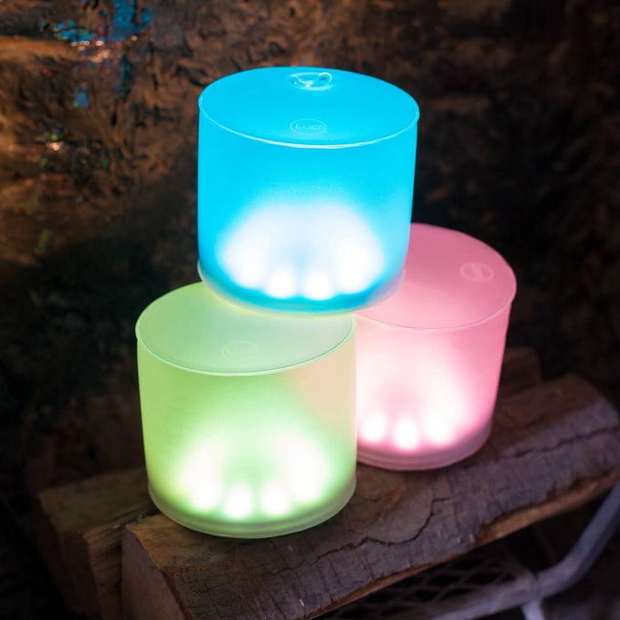 Three handcrafted inflatable LED solar lights glowing in bright blue, soft green, and gentle pink, perfect for eco-friendly camping, garden, and emergency lighting needs.