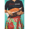 Cover of a handcrafted paperback book showing a woman holding a woven basket with fresh bread, featuring a floral apron and promoting a simpler, sustainable lifestyle, part of Toys, Books & Games, Heritage and Lifestyle Books, and Best Sellers collections.