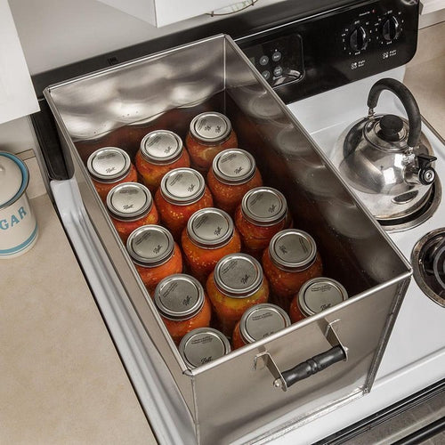 Stainless steel canning pot filled with sealed glass jars of tomato sauce, designed for secure water bath canning, suitable for Kitchen & Food, Food Preservation, and Amish Made collections.