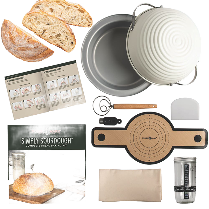 Complete baking kit featuring handcrafted tools including a proofing basket, dough scraper, measuring scale, mixing bowl, and shaping board for sourdough bread in Kitchen & Food collections.