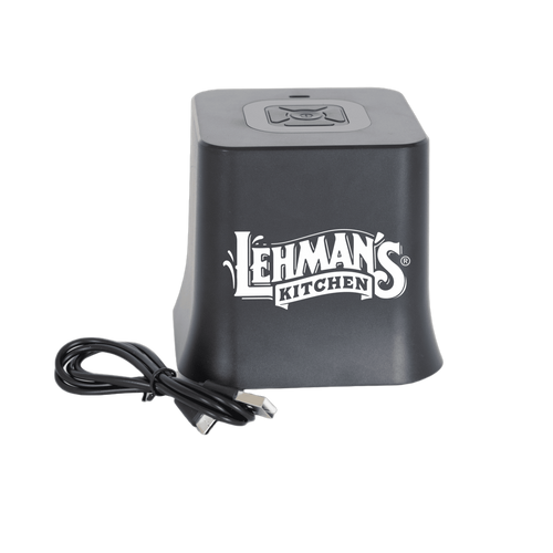 Compact black cordless vacuum sealer unit with digital controls and USB charging cable, designed for kitchen use in food storage and preservation collections.