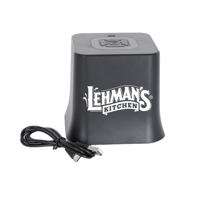 Compact black cordless vacuum sealer unit with digital controls and USB charging cable, designed for kitchen use in food storage and preservation collections.