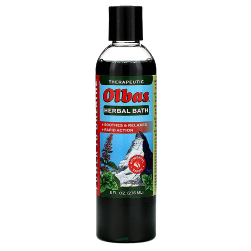 Dark green bottle of Olbas Herbal Bath liquid with black cap, featuring a colorful label highlighting soothing therapeutic herbal ingredients and invigorating aroma for health and wellness.