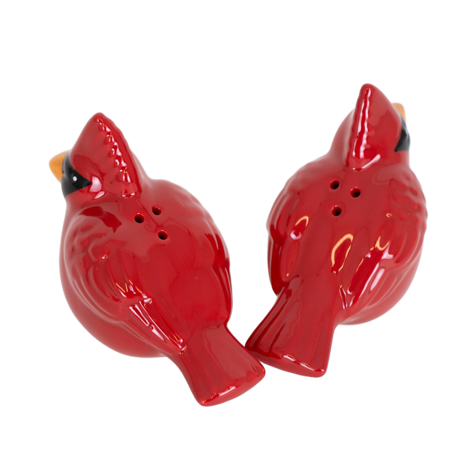 Pair of handcrafted earthenware salt and pepper shakers shaped like red cardinals with hand-painted details, perfect for Kitchen & Food, Dinnerware, and Best Sellers collections.