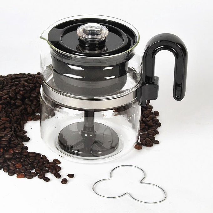 Clear borosilicate glass stovetop percolator with black handle and lid, surrounded by coffee beans, designed for easy brewing and part of Kitchen & Food, Brewing Coffee and Tea, USA Made collections.